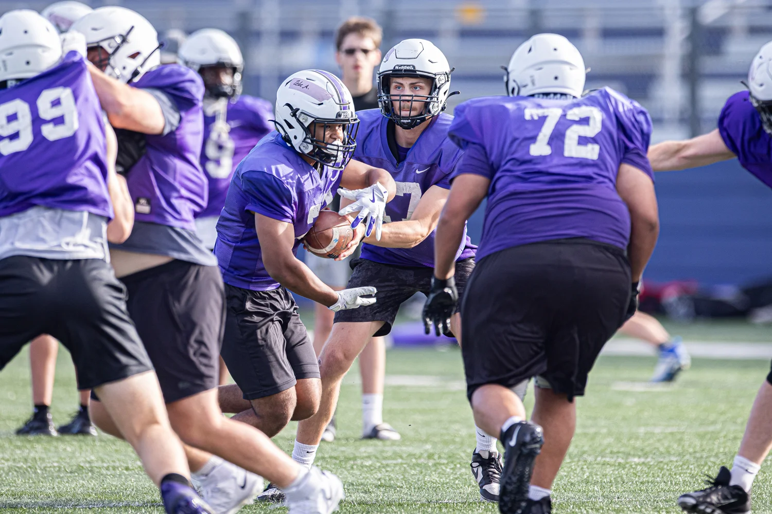 Buffalo Bison Football QB handing the ball off to the RB